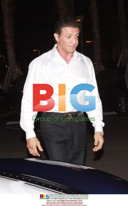 Sylvester Stallone views antique car in Miami