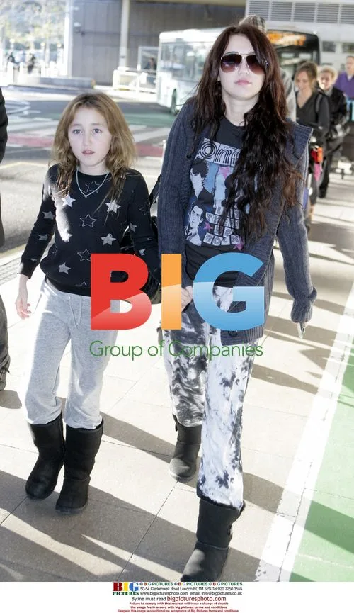 Miley and Noah Cyrus Arrive at Heathrow Airport