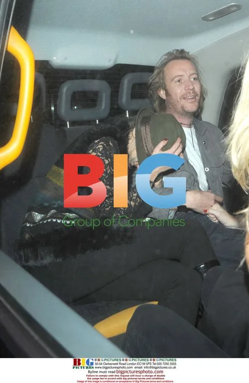 Rhys Ifans and Kimberley Stewart leaving the Hilton