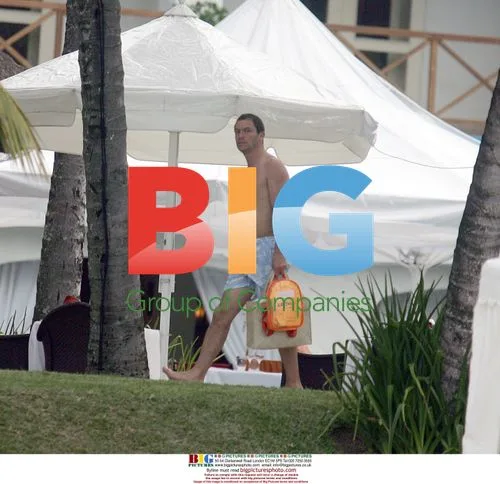Dominic West on beach with family in Mauritius