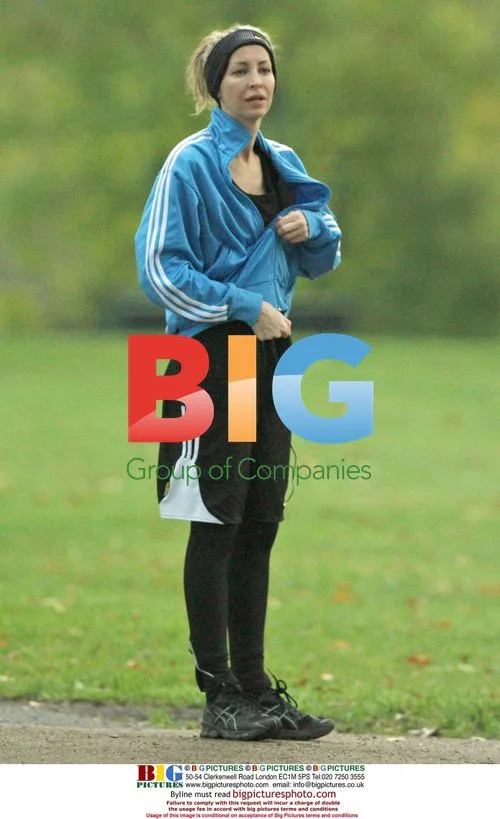 Liam Gallagher and Natalie Appleton running, Nicole Appleton walking dog