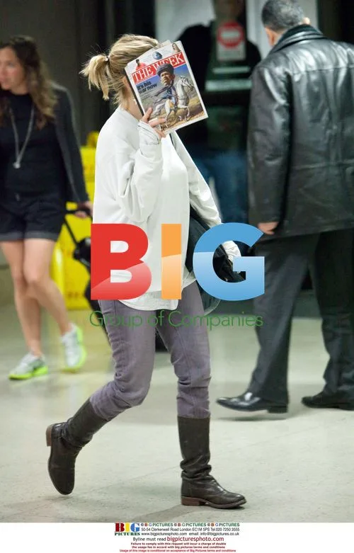 Drew Barrymore at LAX with reading material