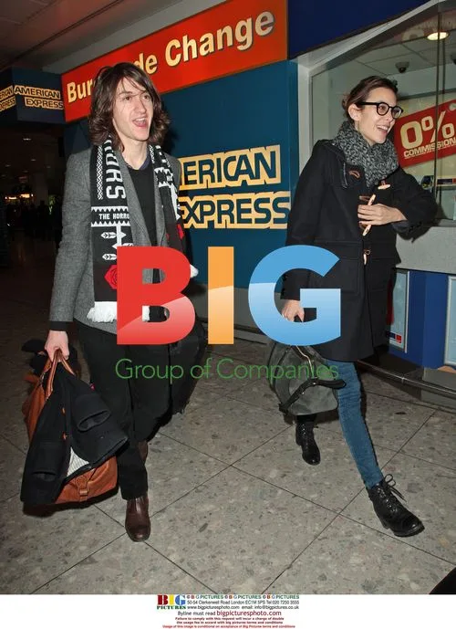 Alexa Chung and Alex Turner Arrive at Heathrow