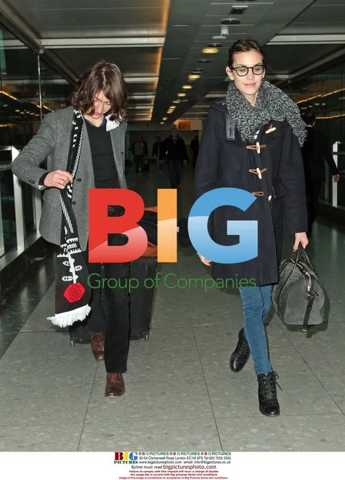 Alexa Chung and Alex Turner Arrive at Heathrow
