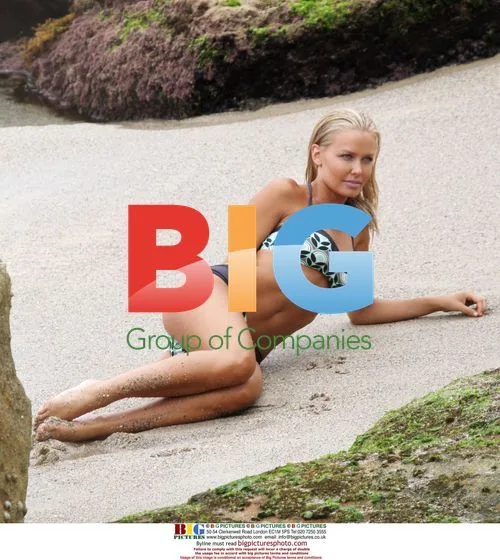 Lara Bingle Poses for Beach Photoshoot