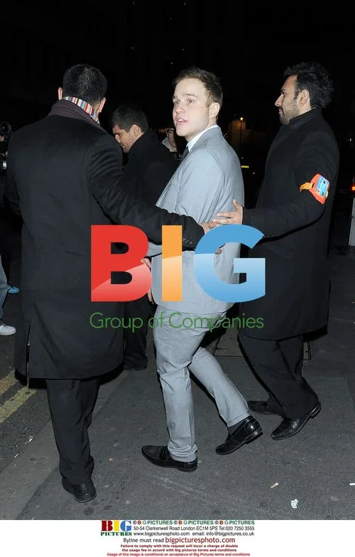 Olly Murs kisses Sianad Gregory at X Factor party