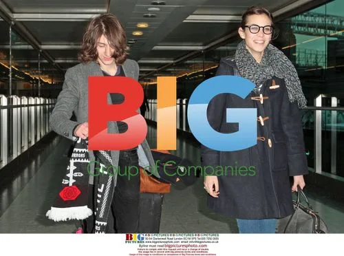 Alexa Chung and Alex Turner Arrive at Heathrow