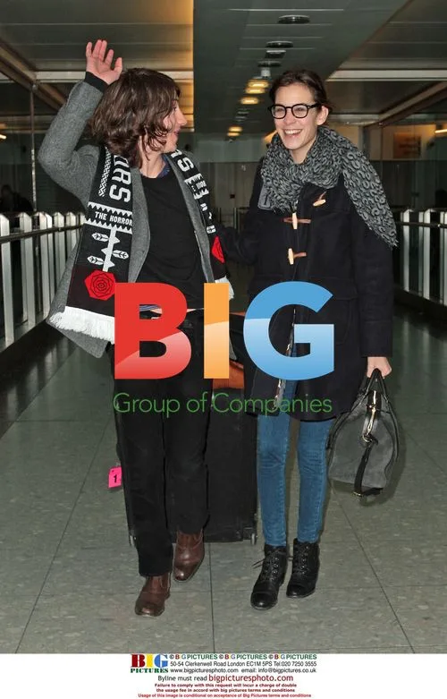Alexa Chung and Alex Turner Arrive at Heathrow