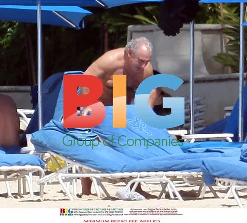 Sir Philip Green relaxes on Barbados beach