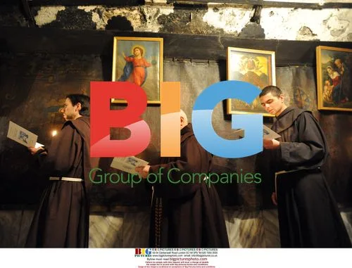 Franciscan brothers pray in Bethlehem grotto