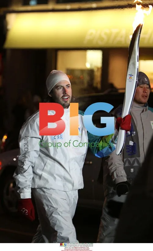 Jason Reitman waits with Olympic torch