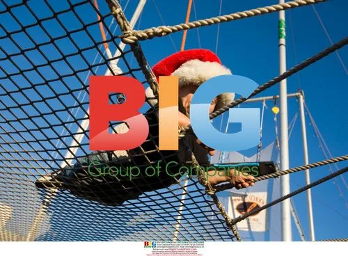Verne Troyer in Santa hat after trapeze jump