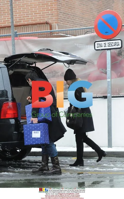 Luis Figo and wife Helen Svedin shopping in Madrid