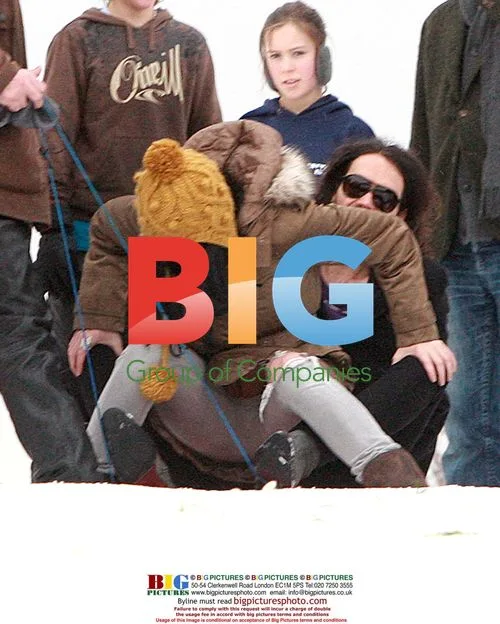 Russell Brand and Katy Perry sledding in London