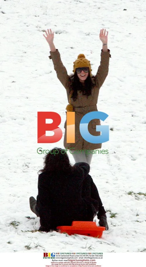 Russell Brand and Katy Perry sledding in London