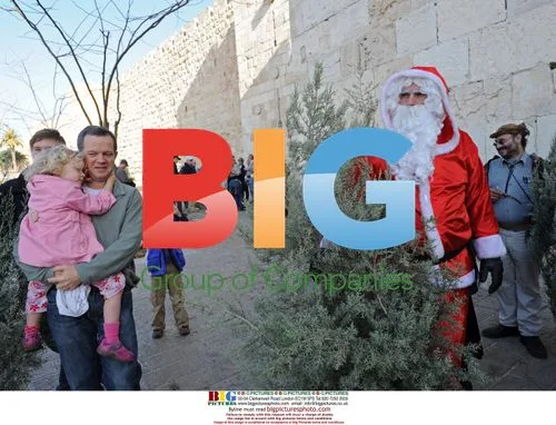 Santa Distributes Christmas Trees in Jerusalem