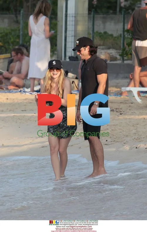 Avril Lavigne takes photos on Saint Barthelemy beach