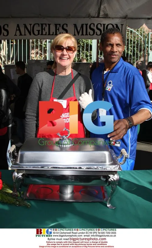 Bonnie Hunt serves food at Christmas Eve event