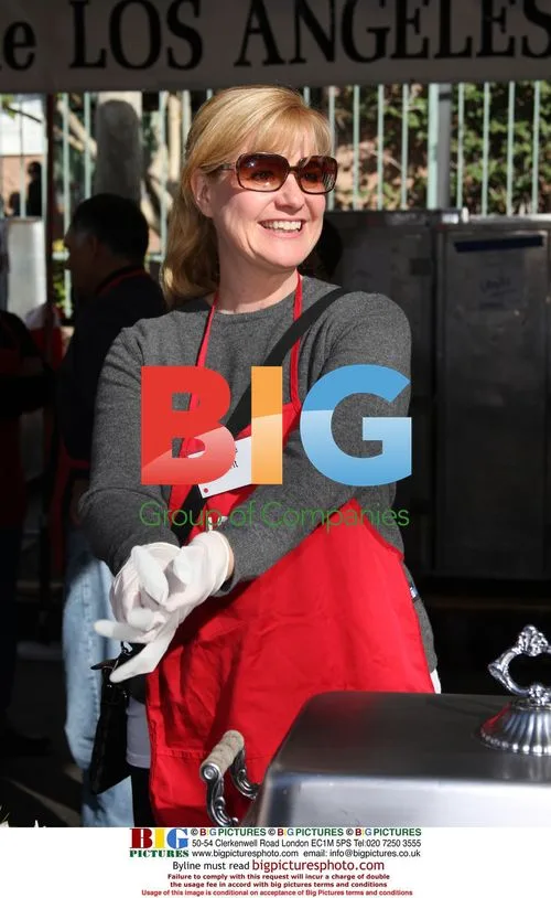 Bonnie Hunt serves food at Christmas Eve event