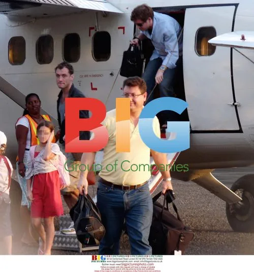 Jude Law arrives in Caribbean with family