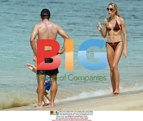 Andriy Shevchenko and wife Kristen Pazik relax on beach