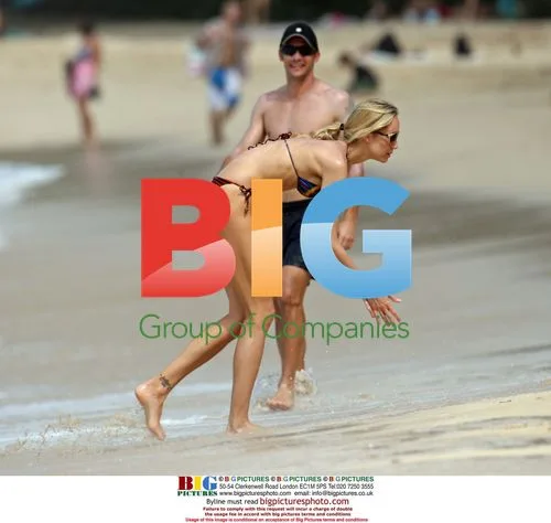 Andriy Shevchenko and wife Kristen Pazik on Caribbean beach