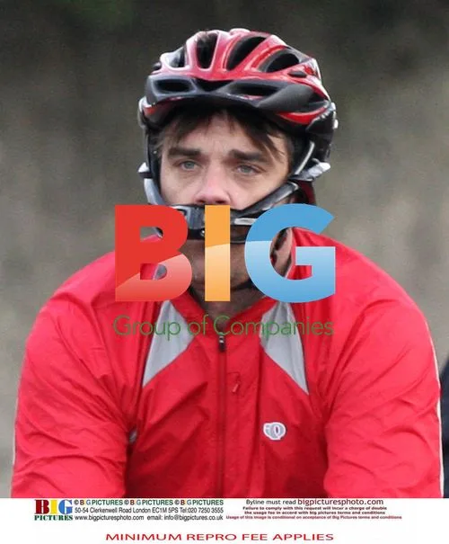 Robbie Williams Test Rides New Bike