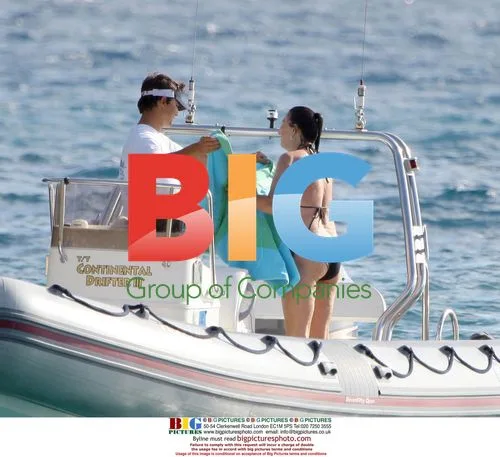 Anjelica Huston relaxes on Jimmy Buffet's boat