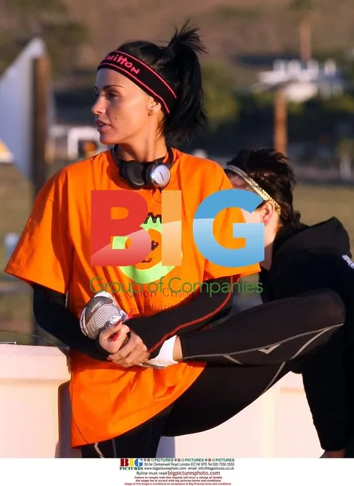 Katie Price and Peter Andre jogging on beach