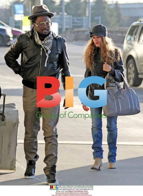 WILL.i.am arrives at YVR with Mystery Girlfriend
