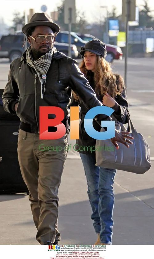 WILL.i.am arrives at YVR with Mystery Girlfriend