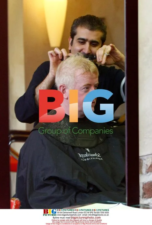 Chris Evans gets haircut in London