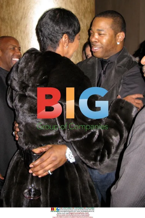 Natalie Cole and Busta Rhymes at Clive Davis party