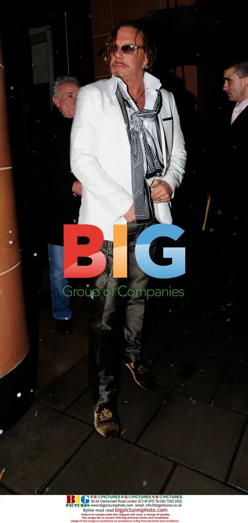 Micky Rourke leaving Cipriani with friends