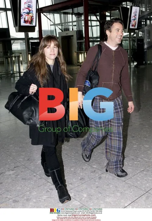 Robert Downey Jnr and wife depart Heathrow