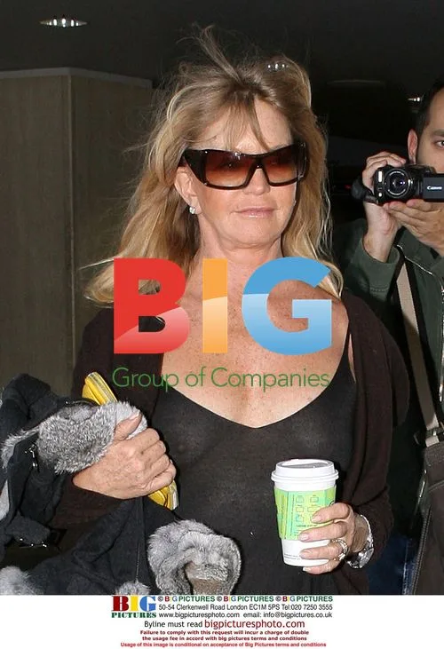 Goldie Hawn Arrives at LAX in Revealing Dress