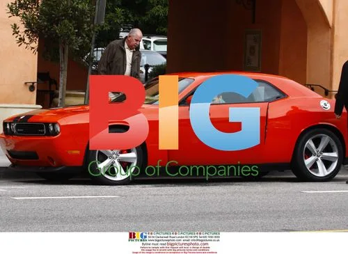 Arnold Schwarzenegger Drives Away