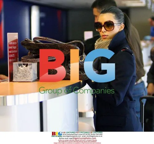 Kim Kardashian and Reggie Bush Check In at LAX