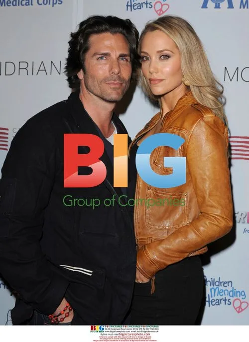 Elizabeth Berkley and Greg Lauren at Benefit