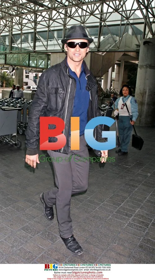 Hugh Jackman smiling at LAX
