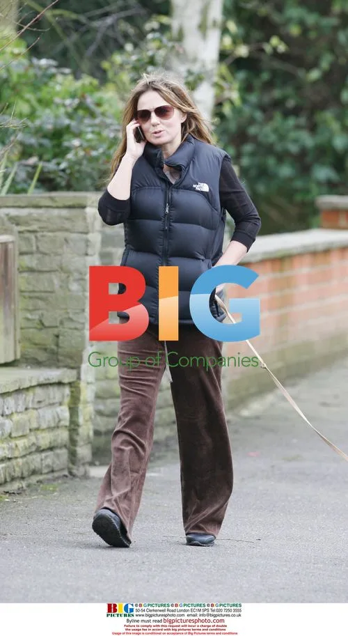 Geri Halliwell walks dog, talks on phone in London