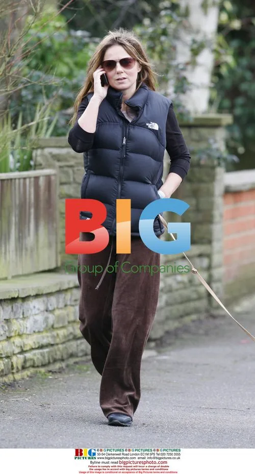 Singer Geri Halliwell walking dog in London