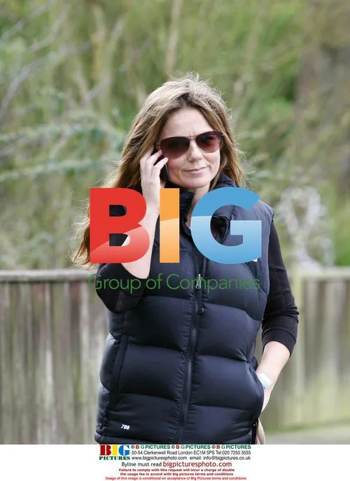 Geri Halliwell walking dog, talking on phone in London