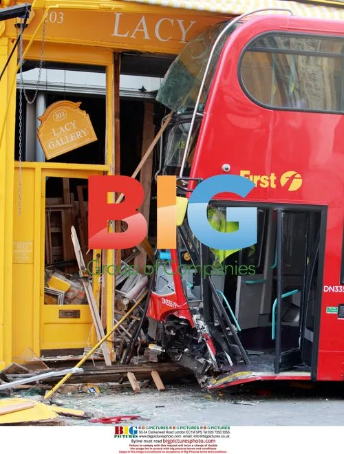 Double-decker bus crashes into shop in London