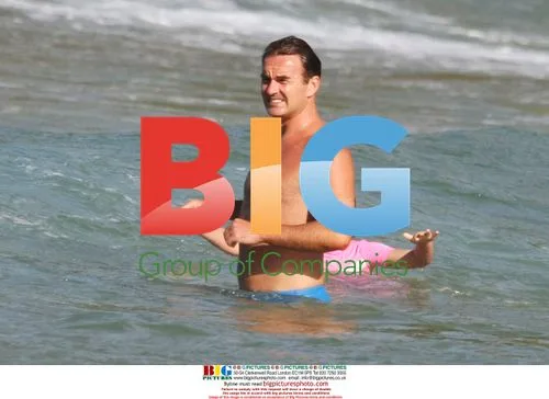 Julian McMahon and Kelly Paniagua on beach