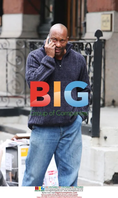 John Singleton chats on phone in Tribeca