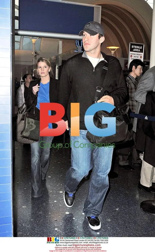 Jessica Simpson and boyfriend Tony Romo arrive at LAX
