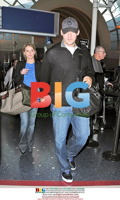 Jessica Simpson and Tony Romo arrive at LAX with dog