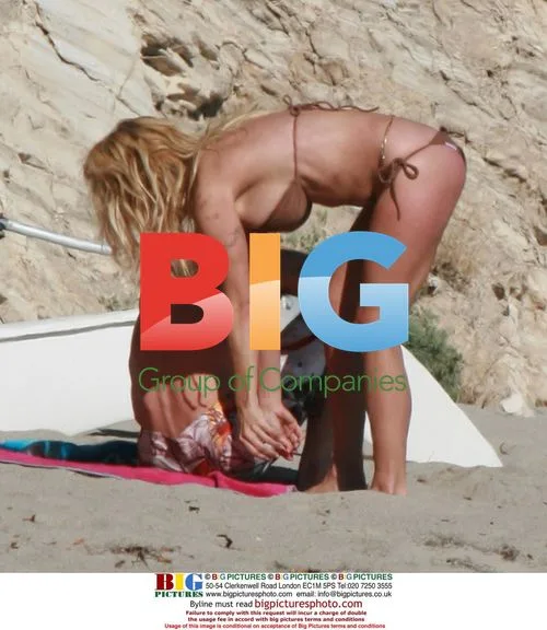 Pamela Anderson Relaxes on Malibu Beach
