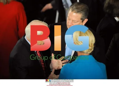 Al Gore speaks with Sen. John McCain and Cindy McCain